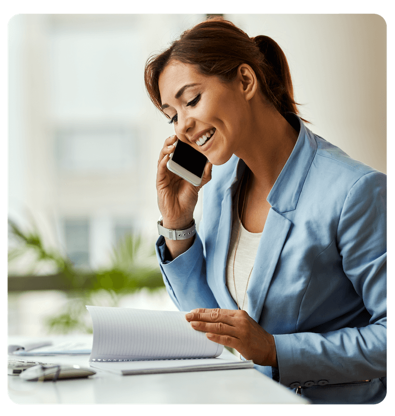 Business woman using cell phone for a phone call
